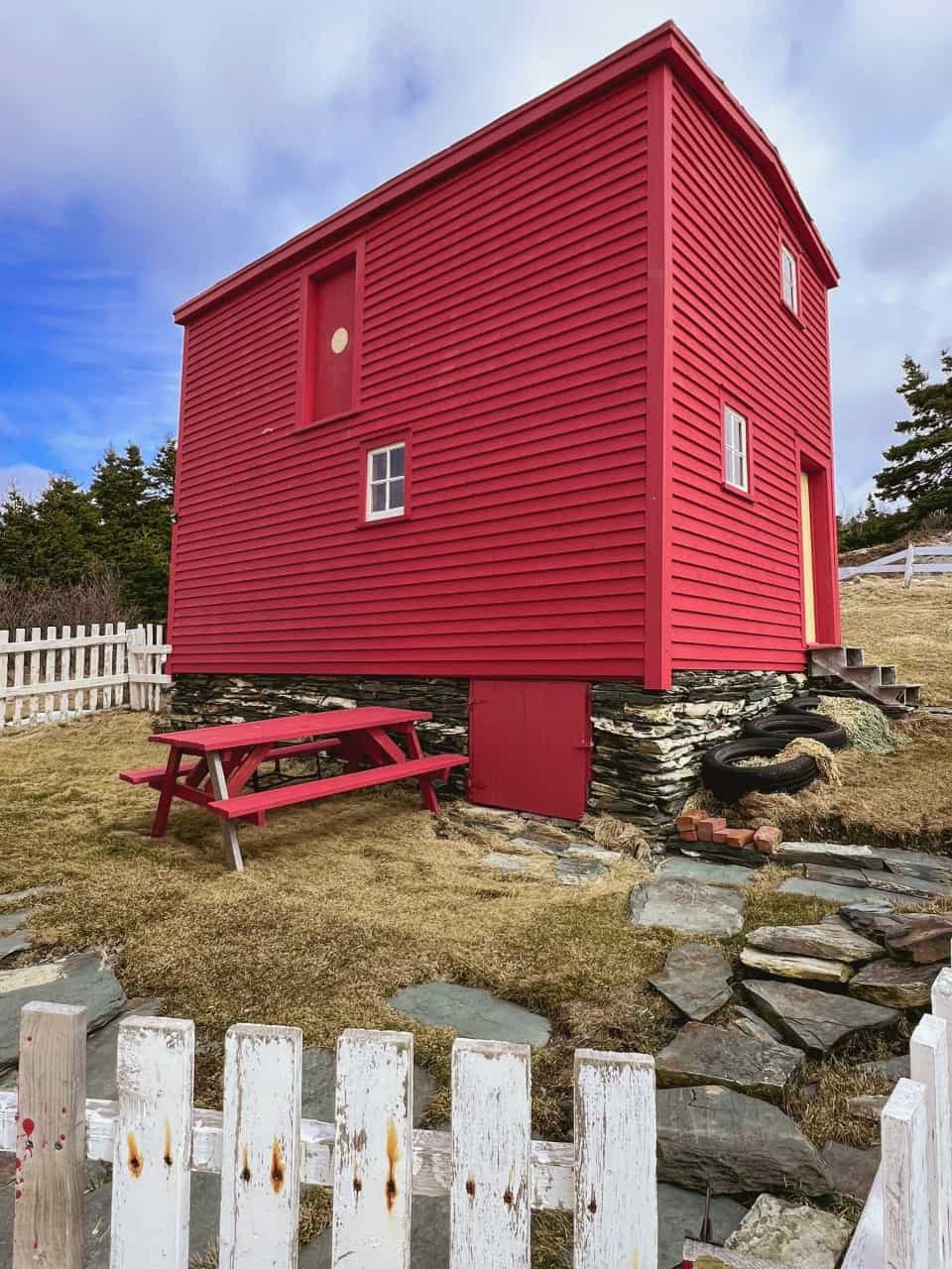 Newfoundland and Labrador historic home  - This red historic barn is on an old fashioned natural stone foundation with a traditional white wooden fence. I could stay there and never leave.