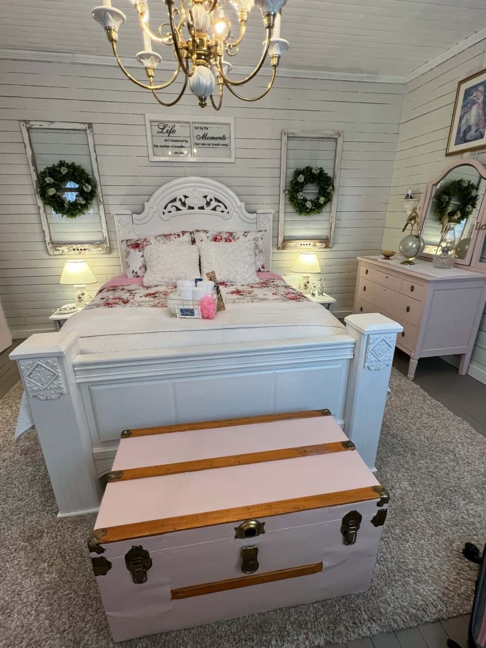 Pink vintage trunk at vacation suite created a whimsical feel  - The cozy vintage decor at the Wade House queen vacation suite in NL Canada was creative and unique. The different shades of pink added a feminine feel to the space.